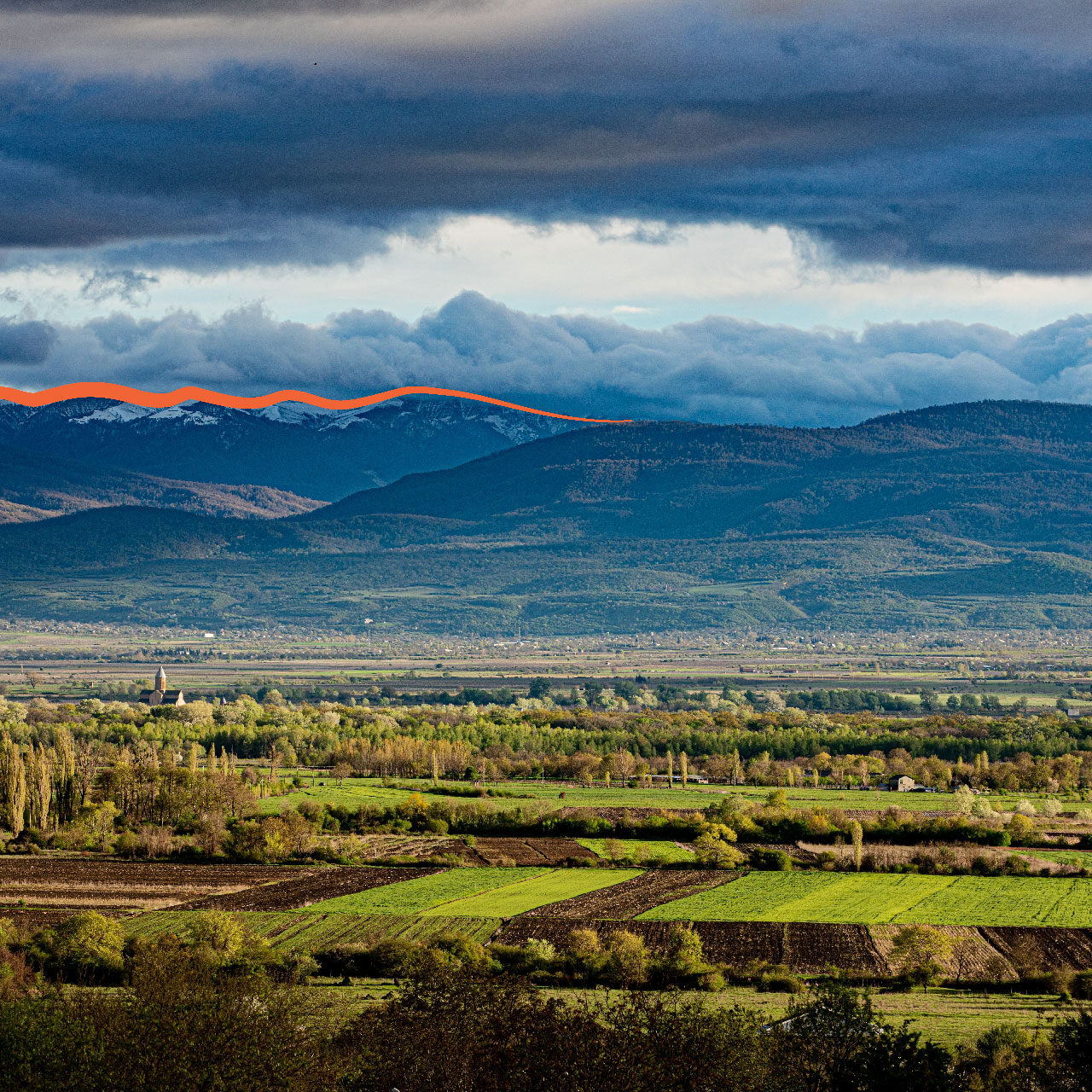 green-fields-with-mountains-background Green Fields With Mountains Background